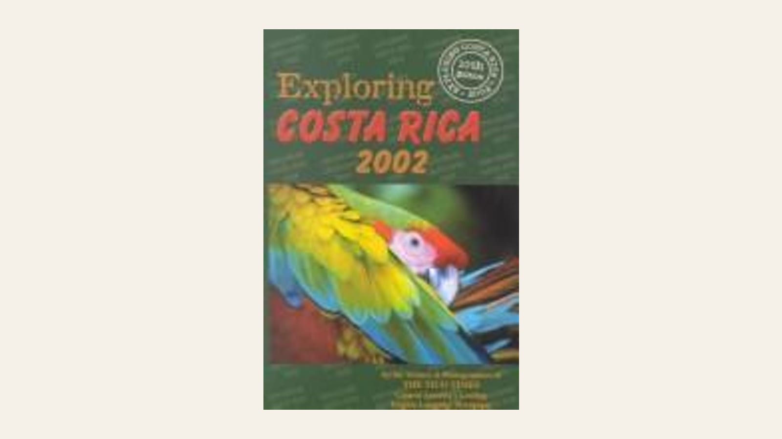 Portada de Exploring Costa Rica 2002, la guía del Tico Times, con una lapa roja