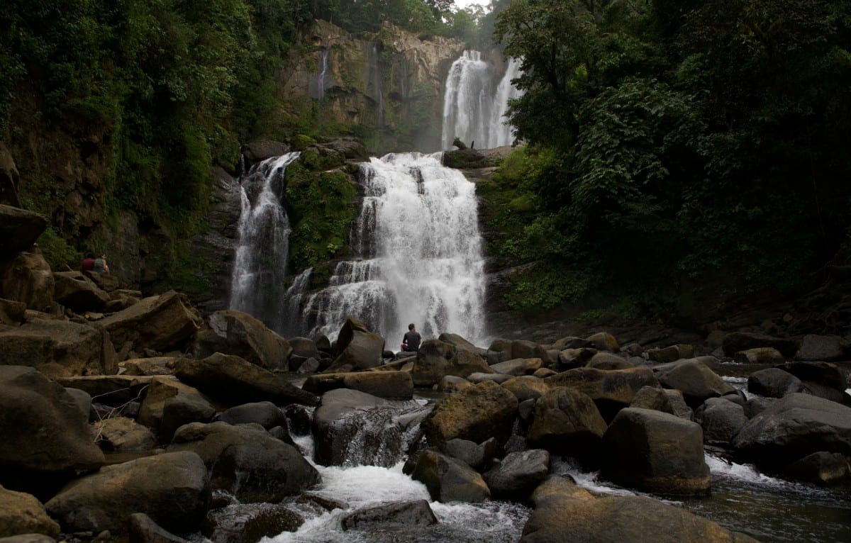 The falls above the boulder river that runs out from them