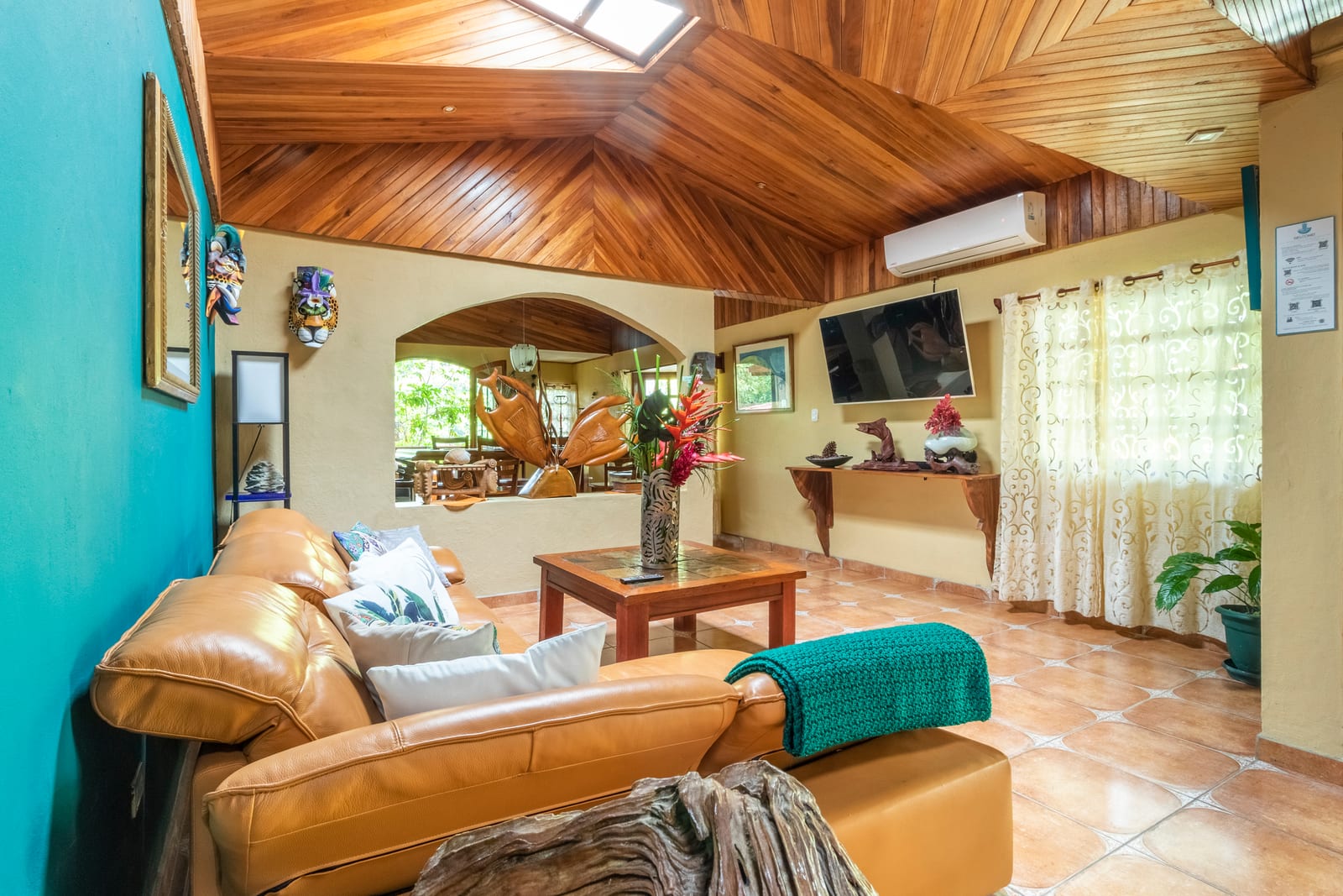 Casa Cascadas living room with cathedral wood ceiling and Costa Rican hardwood details